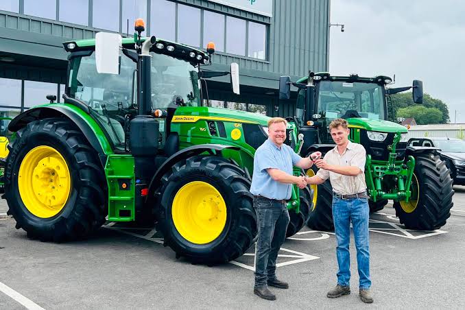 Handing over the keys to a new tractor